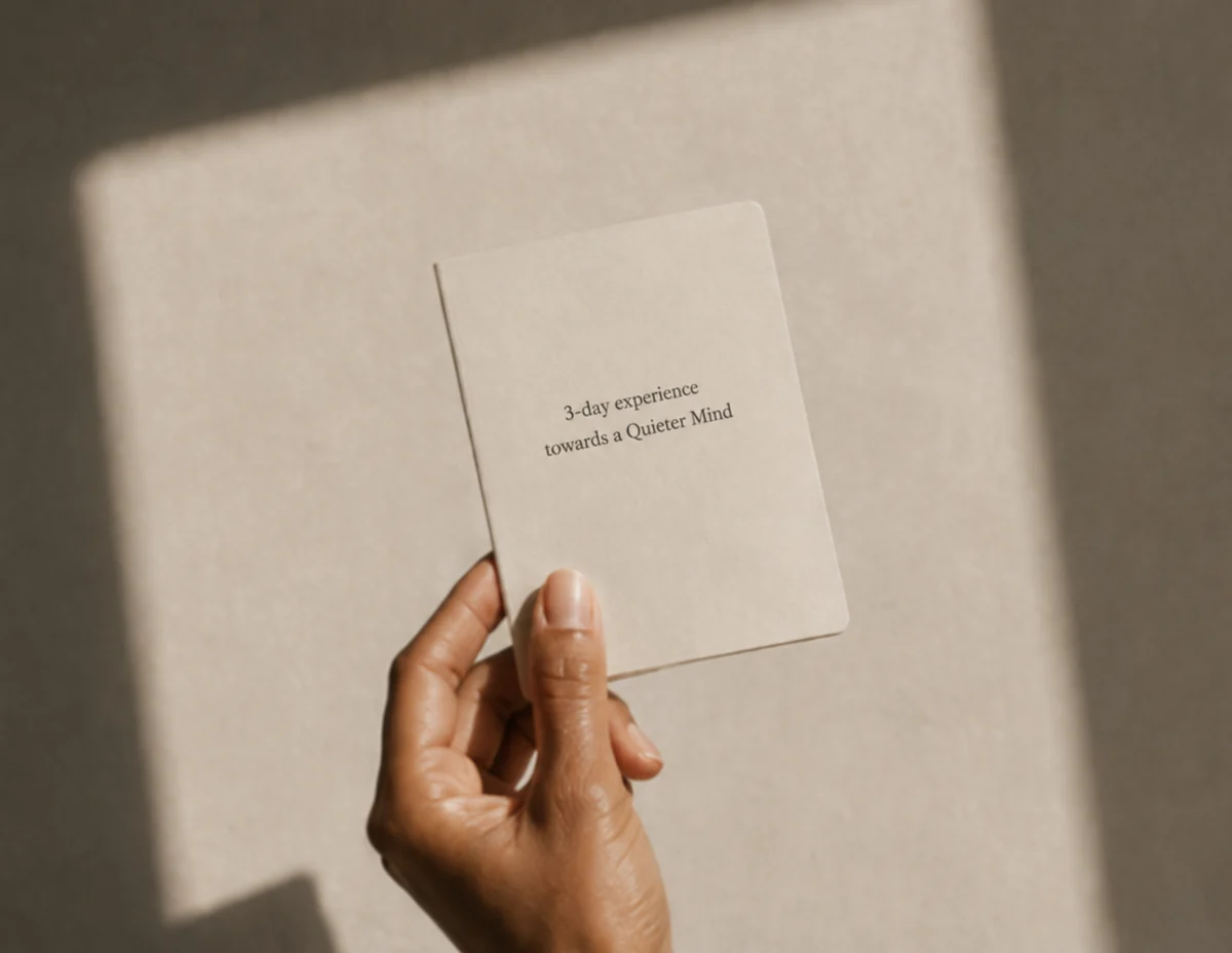 A small cream card reading 3-day experience towards a Quieter Mind